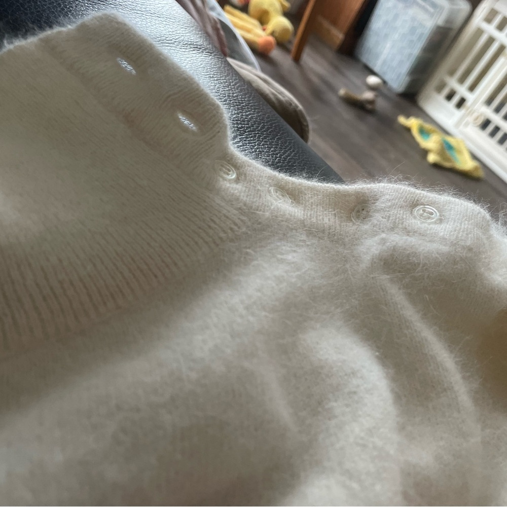 Cream colored lambswool sweater.